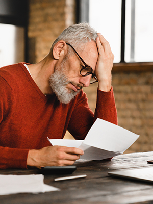 man looking at his statements