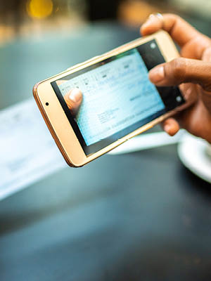 someone taking a picture of a check