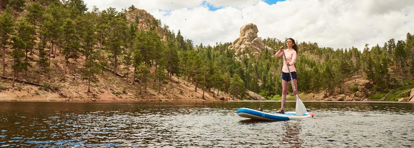 person paddle boarding