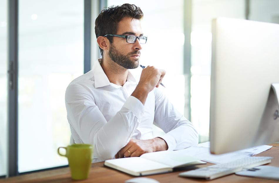 picture of a man looking at a computer