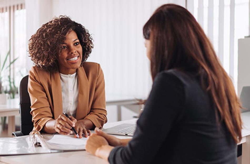 two women working at a desk