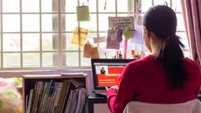 Student doing homework on her laptop. 