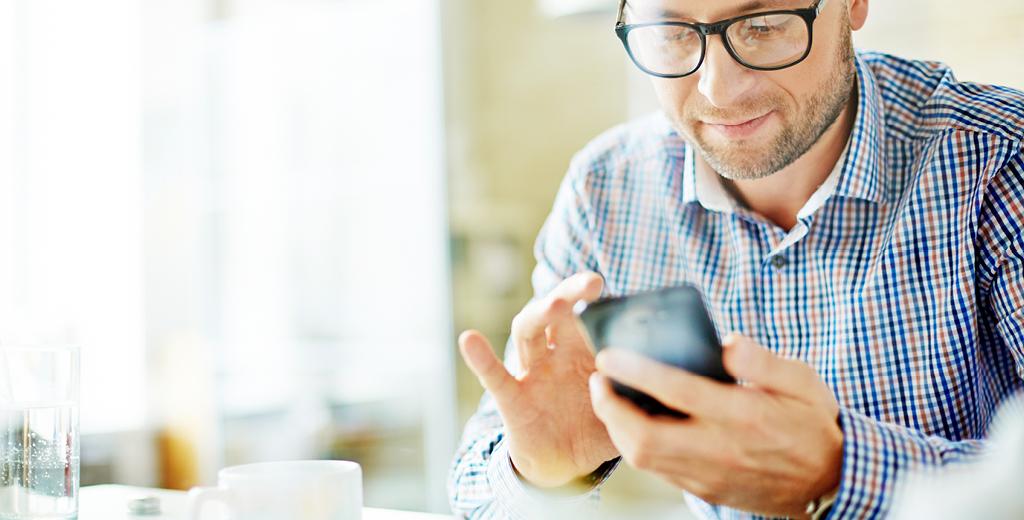 man looking at his smartphone